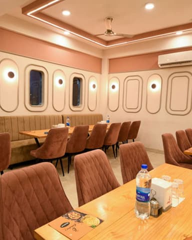 Restaurant interior with warm lighting and elegant seating